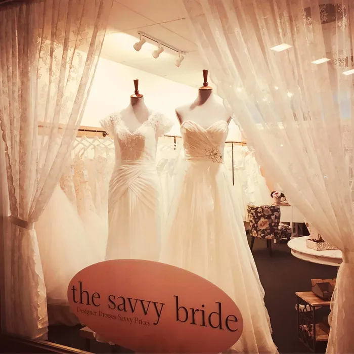 The Savvy Bride shop window on Main Street with two gowns on display